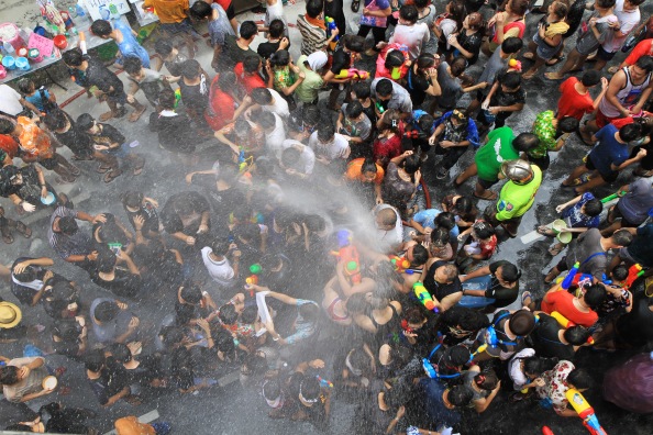 People celebrating the Songkran New Year Festival in Bangkok, Thailand.